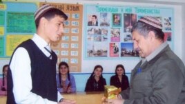 RFE/RL contributor Sazak Durdymuradov (right) in the classroom prior to his late-June detention