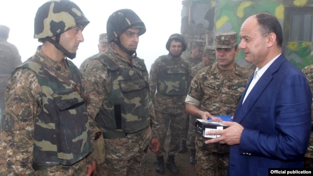 Armenia - Defense Minister Seyran Ohanian (R) awards soldiers on frontline duty.