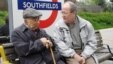 RFE/RL correspondent Zafer Karatay sits with the subject of his documentary, Crimean Tatar novelist and poet Cengiz Dagci.