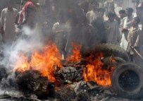 Protesters burn tires in Quetta on August 28, two days after Bugti's death (epa)