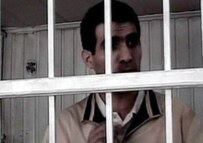 One of the members of the Nima group behind bars (official site)