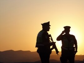 Israeli security officers patrol at a roadblock near the Egyptian border