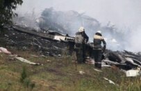 Firefighters on the scene of the crash (epa)
