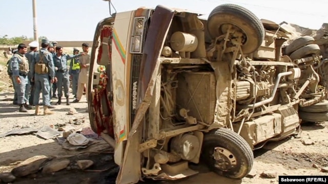 A minivan lies ruined at the site of a roadside bombing in Kabul on August 7.