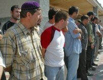 Chechen fighters laying down their arms in Gudermes today (ITAR-TASS)