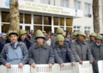Police block a building in Kyrgyzstan on 18 March