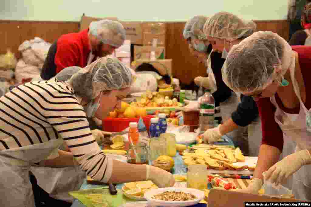 Food staples like sausages, potatoes, and oatmeal are donated by protesters and their supporters. The kitchen staff prepare some hot meals, but many protesters are subsisting on sandwiches.