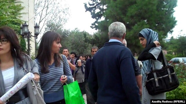 School officials enforce the ban on wearing hijab at the Teachers Institute in Baku in September.