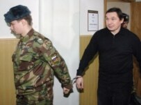 Pereverzin being led into court on March 1 (ITAR-TASS)