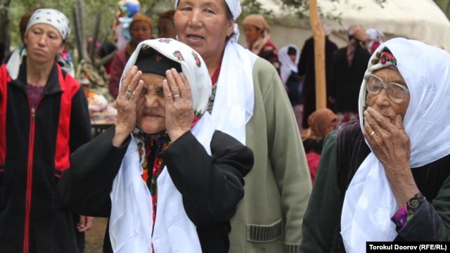 Torokul Doorov's winning photograph shows women offering their blessings at a circumcision celebration in Batken Region, Kyrgyzstan.