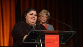 RFE/RL Azerbaijani service correspondent Khadija Ismayilova accepting the 2012 "Courage in Journalism" award from the International Women's Media Foundation. Behind Ismayilova is Lesley Stahl, CBS News journalist and presenter of the award. The ceremony took place in New York on October 24, 2012. Photo: IWMF/Stan Honda