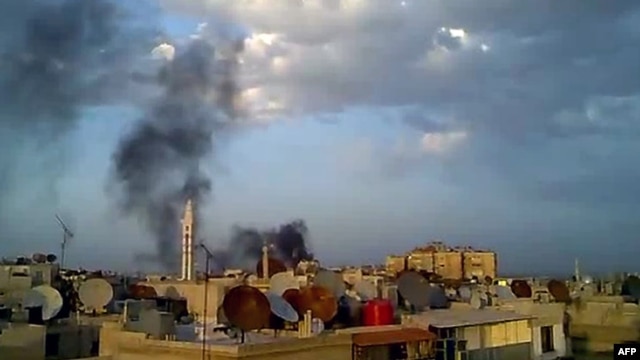Smoke billows from the Damascus suburb of Douma during shelling by government forces on April 15.