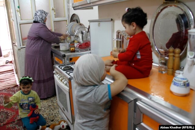 Iman Mohammed at home with her daughters Shahad, Shams, and Batoul