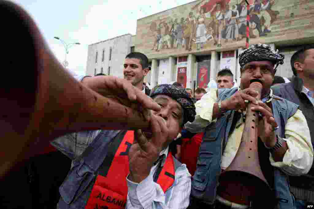 Musicians perform in the main square in Tirana, the Albanian capital.