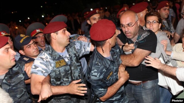 Armenia - Protesters clash with riot police near the Harsnakar restaurant in Yerevan, 8Jul2012.