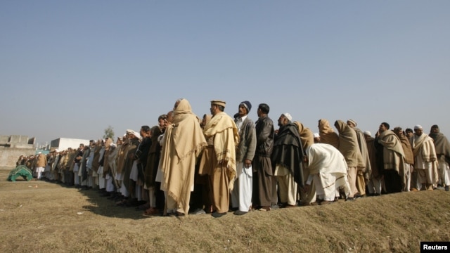 A funeral prayer is held in Swabi for Lubna Mahmood, 26, one of the aid workers who was killed by unidentified gunmen.