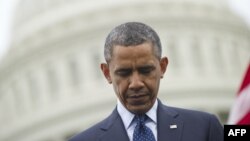 U.S. President Barack Obama bows his head during a prayer on May 15 at the National Peace Officers Memorial Service, an annual ceremony honoring law enforcement officers who were killed in the line of duty last year.
