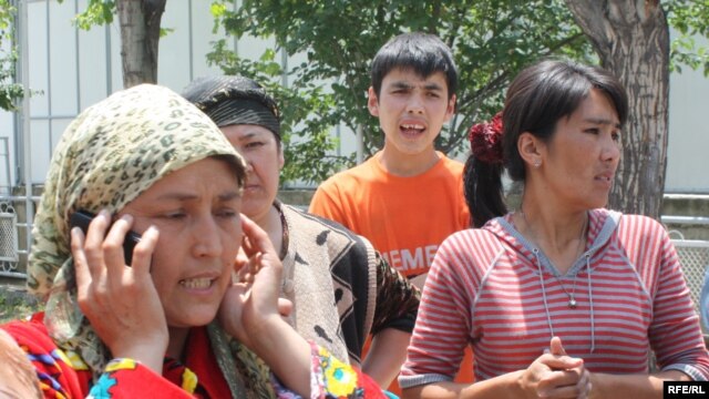 "We don't know where our men are," says Kholida Ahmedova (on the phone), one of several ethnic Uzbeks who sought shelter in the neighborhood of Otkhona in Osh shortly after ethnic clashes broke out in the city.