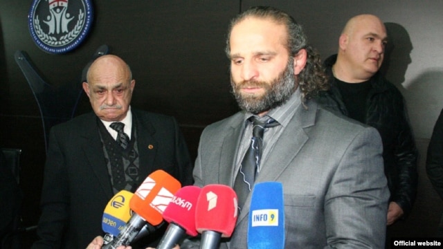 The allegations center on two-time world champion Luka Kurtanidze (center), who is accused of viciously beating up his deputy, Temur Kazarashvili, as well as prominent wrestler Raindi Abramishvili.