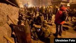 Thousands of protesters remain in a tense standoff with police on Kyiv's Independence Square, which has been the epicenter of antigovernment protests that began three months ago.