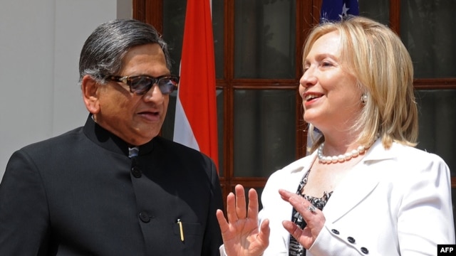 U.S. Secretary of State Hillary Clinton (right) talks with Indian Foreign Minister S.M. Krishna talks in New Delhi on July 19.