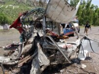 A vehicle destroyed by the suicide bombing in the town of Hangu (AFP)