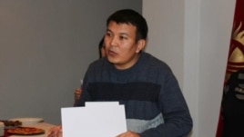 Radio Azattyk correspondent Kubanychbek Joldoshev, accepting first prize in the 2012 Environmental Journalism Competition at a December 4 ceremony in Bishkek.