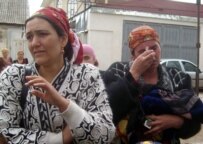 These women were among some 20 taken away by police after protesting against the demolition of their homes (RFE/RL)