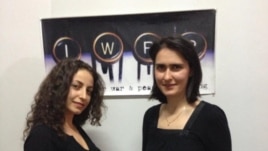 RFE/RL Armenian Service reporters Ruzanna Stepanyan (left) and Lilit Harutyunyan following the award ceremony, held at IWPR's Tbilisi office on December 3, 2012.