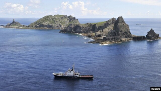 A Japanese survey vessel sails around a group of disputed islands known as the Senkaku in Japan and Diaoyu in China in the East China Sea.