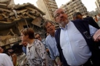 European Commission aid commissioner Louis Michel (right) inspecting damage in southern Beirut on August 15 (epa)