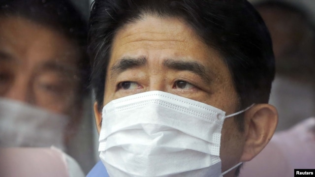 Prime Minister Shinzo Abe inspects the tsunami-crippled Fukushima Daiichi nuclear power plant in Fukushima Prefecture on December 29.
