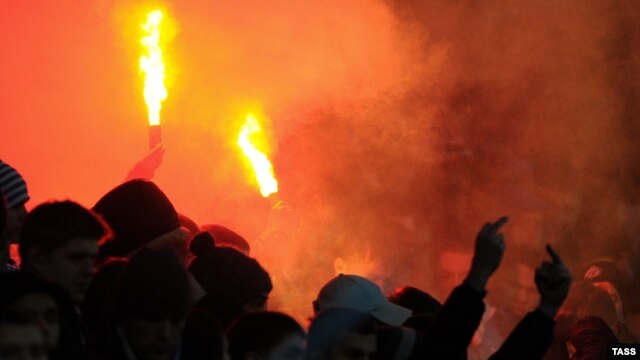Fans light flares during a Russian-league match between Dynamo Moscow and Zenit St. Petersburg in Moscow, on November 17.