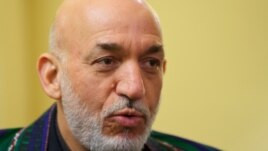 Afghan President Hamid Karzai was presented with a collection of documents while visiting the United States.