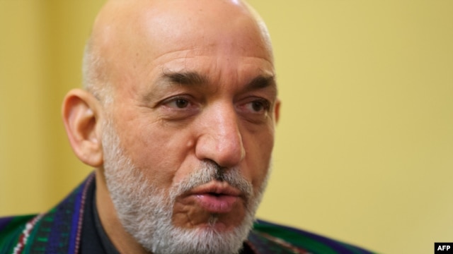 Afghan President Hamid Karzai was presented with a collection of documents while visiting the United States.