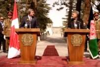 Canadian Prime Minister Harper (left) with Afghan President Hamid Karzai in Kabul in March (RFE/RL)
