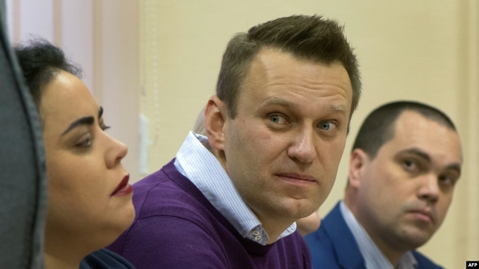 Aleksei Navalny (center) looks on during a court hearing in Kirov on December 5.