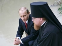 President Putin praying at the Jordan River on February 13 (TASS)