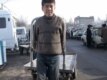 The hours are long and the work arduous carting goods around this Kyrgyz market (RFE/RL)
