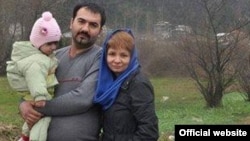 Soheil Arabi is pictured with his family in an undated photograph