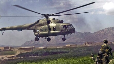 Afghanistan --  Coalition forces give security cover for a helicopter as they prepare for extraction in Gulistan district, Farah province, 12Apr2009