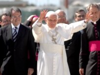 Pope Benedict, flanked by Italy's outgoing Prime Minister Romano Prodi (left), waves to onlookers before boarding a plane in Rome for the United States (epa)