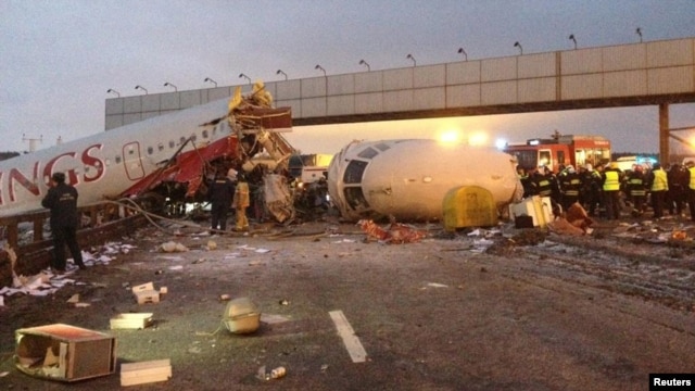 The  wreckage of the Tupolev Tu-204 airliner is seen on a highway near Moscow's Vnukovo Airport on December 29.