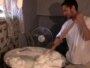 Tajikistan -- A man cooks nishollo, the Tajik national food, 16Aug2010