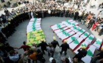 Lebanese civilians hold a funeral on August 18 in Qana for victims of the recent violence (epa)