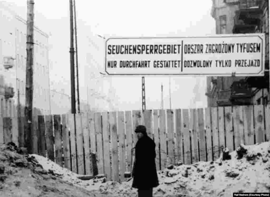 A sign in the ghetto forbids entrance to the area quarantined for typhus sufferers.