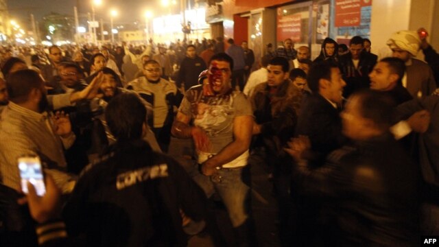 Supporters of the president and the opposition clashed violently in Cairo on December 5.