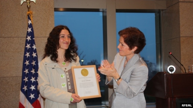Mariam Sukhudian (left) receives an award from U.S. Ambassador Marie L. Yovanovitch.