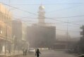 Dust rising from the mosque after the June 13, 2007, attack that brought down both minarets (Fars)