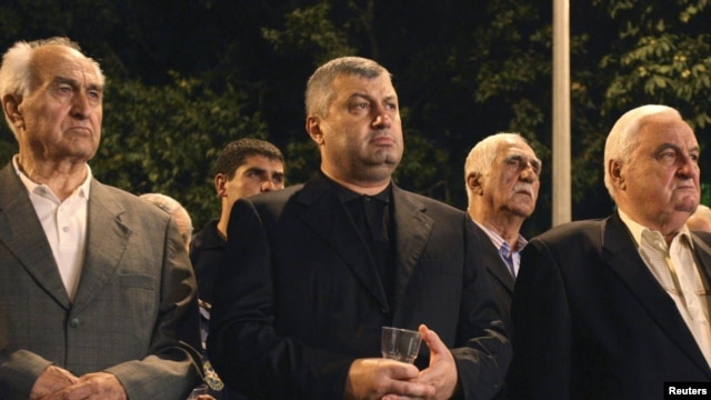 The upcoming election is not just about who succeeds Eduard Kokoity (center) as leader of the breakaway Georgian region, but about whether and on what terms South Ossetia can preserve its quasi-independent status.